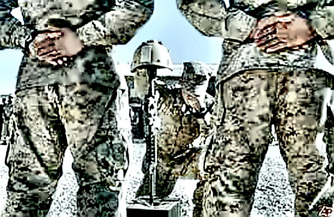A soldier weeps by a monument to a fallen comrade in Afghanistan