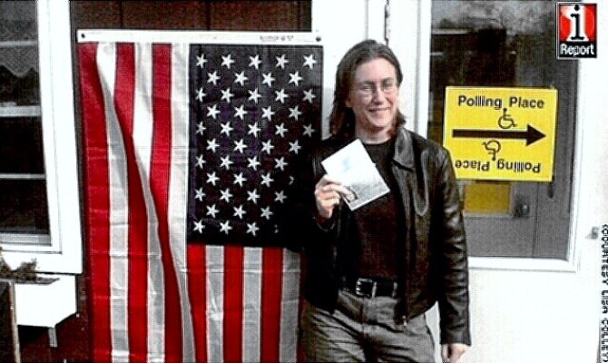 Voter Colley proudly stands outside Marathon, NY, polling place