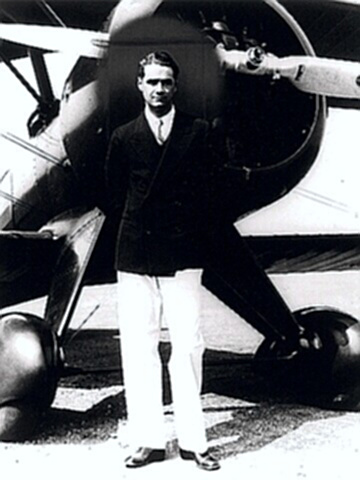 Aviator Howard Hughes by his plane