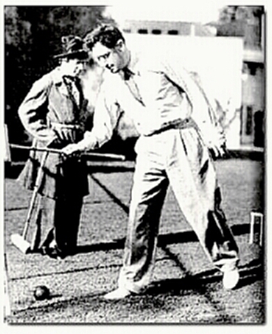 Playwright George S. Kaufman - yes, that is Harpo in the background