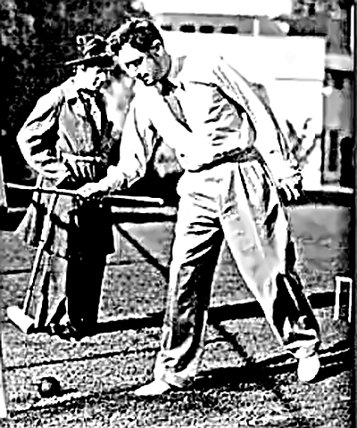 Playwright George S. Kaufman - yes, that is Harpo in the background