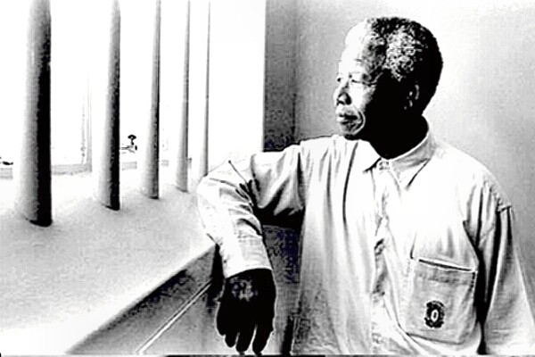 Nelson Mandela behind prison bars