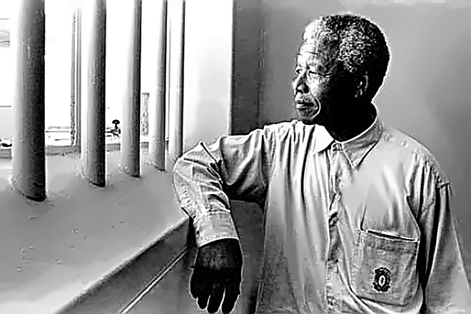 Nelson Mandela behind prison bars