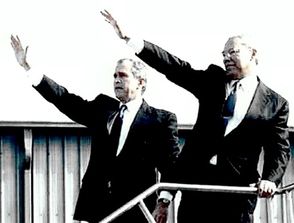 Colin Powell and President Bush with their right arms raised