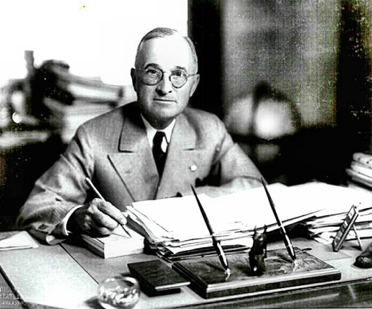 President Truman at his White House desk