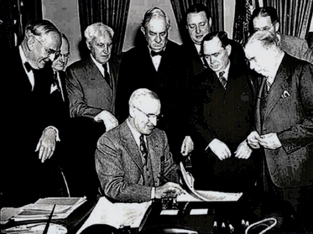 Truman signs Marshall Plan